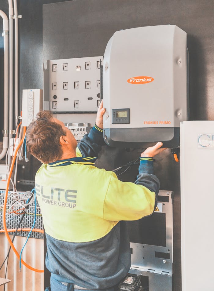 about-us Expert technician setting up a solar inverter in Thornton, NSW, ensuring efficient solar energy flow.
